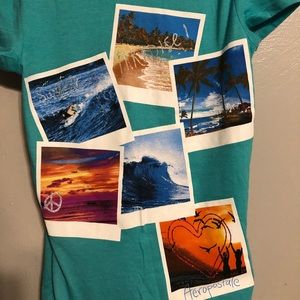 A teal Aeropostale shirt with tropical pictures.